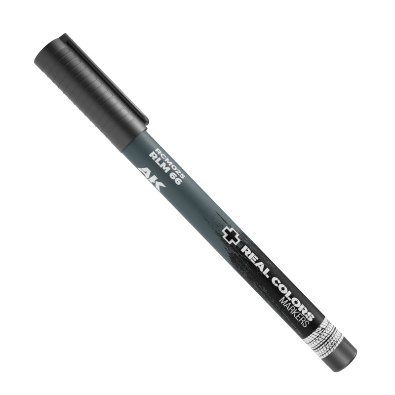 Black marker pen with visible branding on a white background