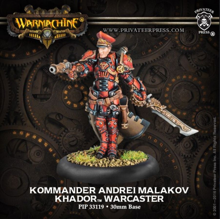 A miniature figure of a warcaster named Andrei Malakov in red and black armor, holding a sword, on a round base with the text 'Kommander Andrei Malakov - Warcaster'.